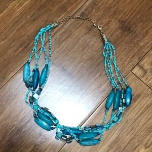 Turquoise and blue colored beaded Necklace, with gold colored chain & closure